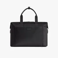 Monos Metro Duffel in black ballistic nylon with leather trim, three-quarter view