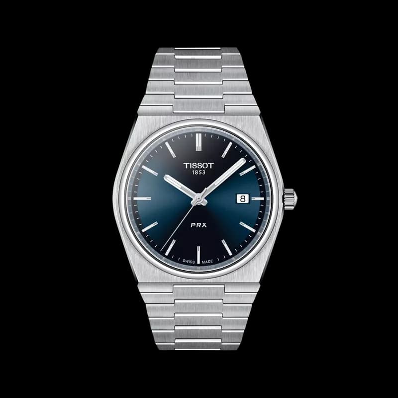 Tissot PRX 40 Quartz with blue waffle-textured dial on integrated stainless-steel bracelet, face-on view